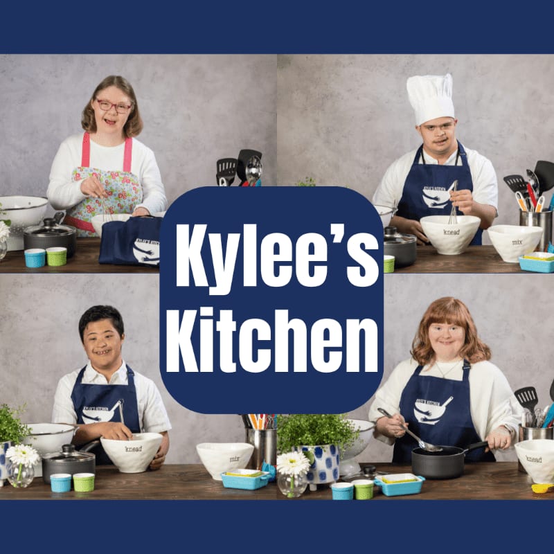 Four individuals, two women and two men, are shown in separate quadrants of the image, each wearing aprons and engaged in cooking activities in a kitchen setting, with the text "Kylee's Kitchen" overlaid in the center.