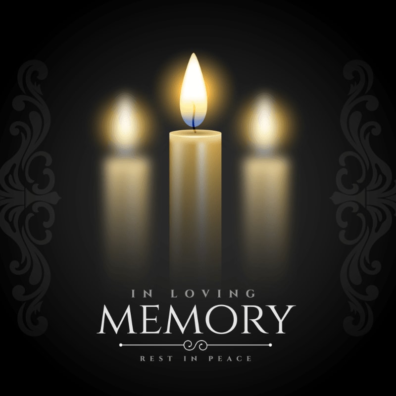 Three lit candles glow softly in the foreground against a dark background with ornate decorative borders and the words "IN LOVING MEMORY REST IN PEACE."