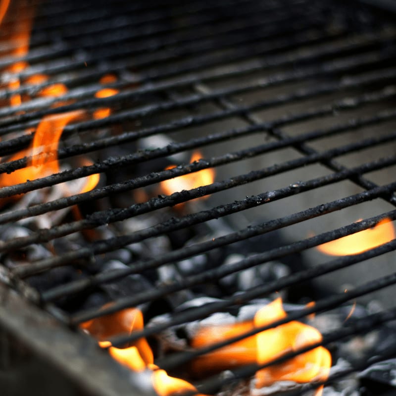 burning charcoal on charcoal grill