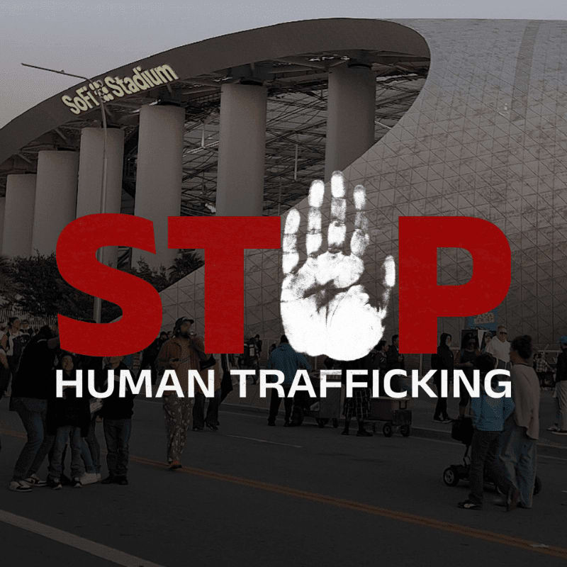 A large red "STOP" with a handprint in the "O" is superimposed over a crowd of people in front of SoFi Stadium.