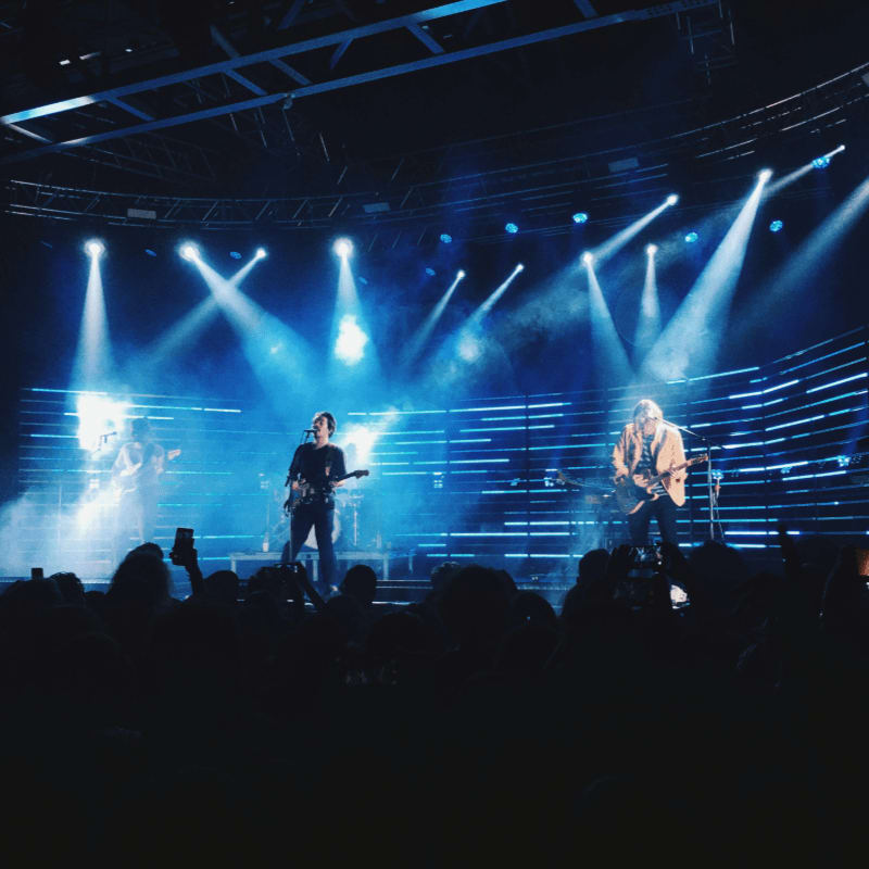 a group of people standing on top of a stage