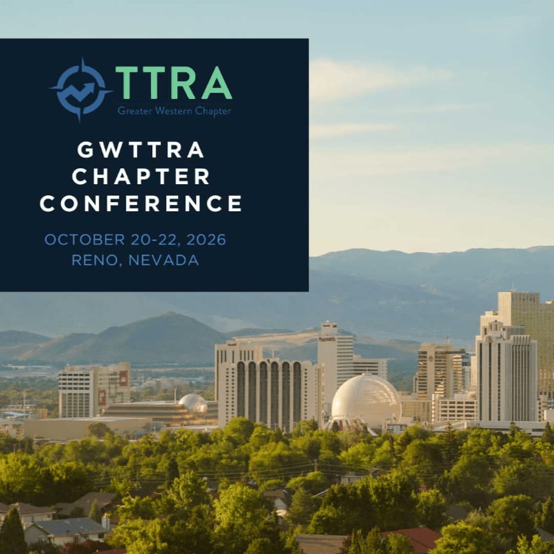 A dark blue overlay with conference details sits above a cityscape with trees in the foreground and mountains in the background under a clear sky.