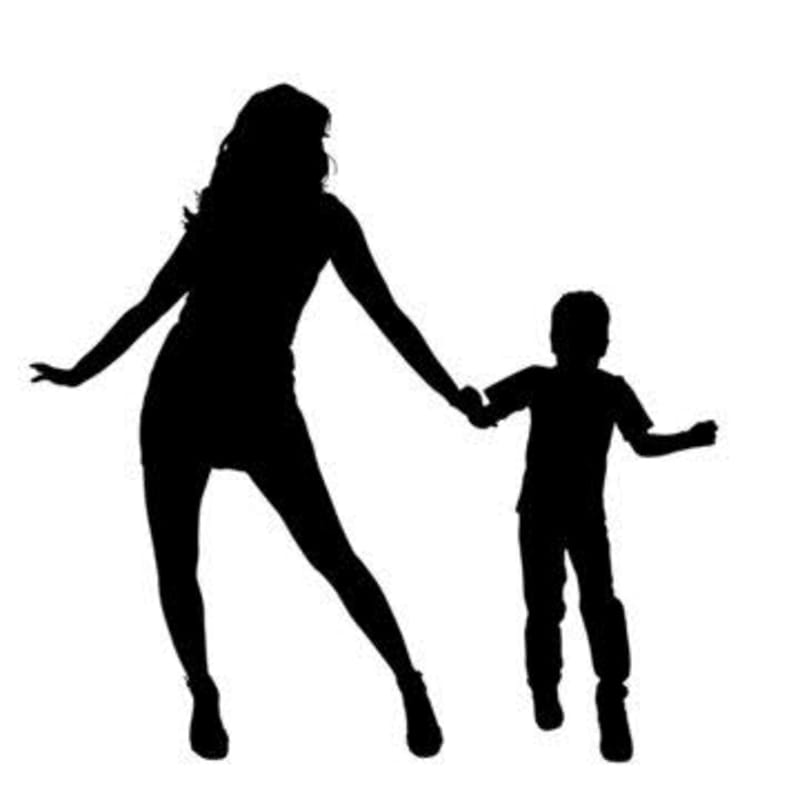 Silhouetted figures of a woman and child hold hands against a stark white background.
