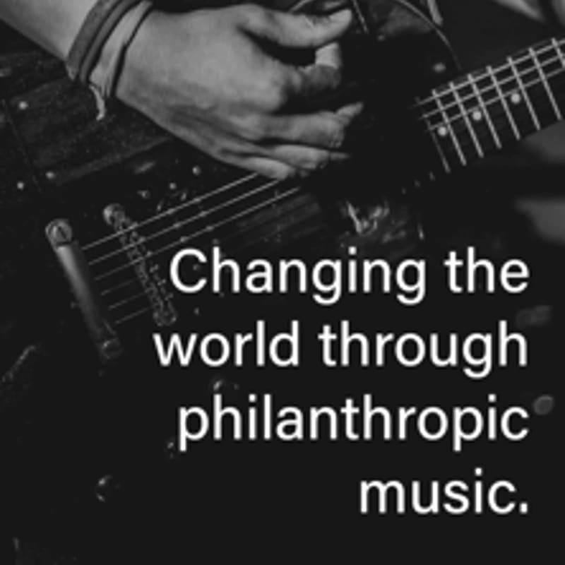 A close-up of hands playing an electric guitar is overlaid with the text "Changing the world through philanthropic music."