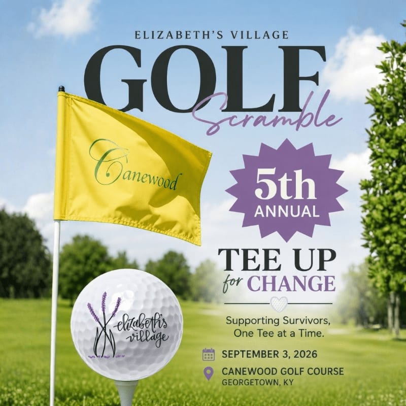A yellow flag with "Canewood" written on it stands beside a golf ball with "Elizabeth's Village" on it, with a golf course and trees in the background.