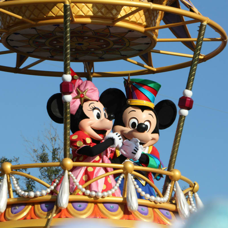 mickey mouse riding on swing ride