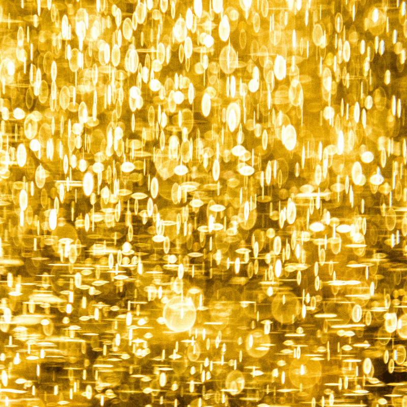 a yellow background with lots of small circles