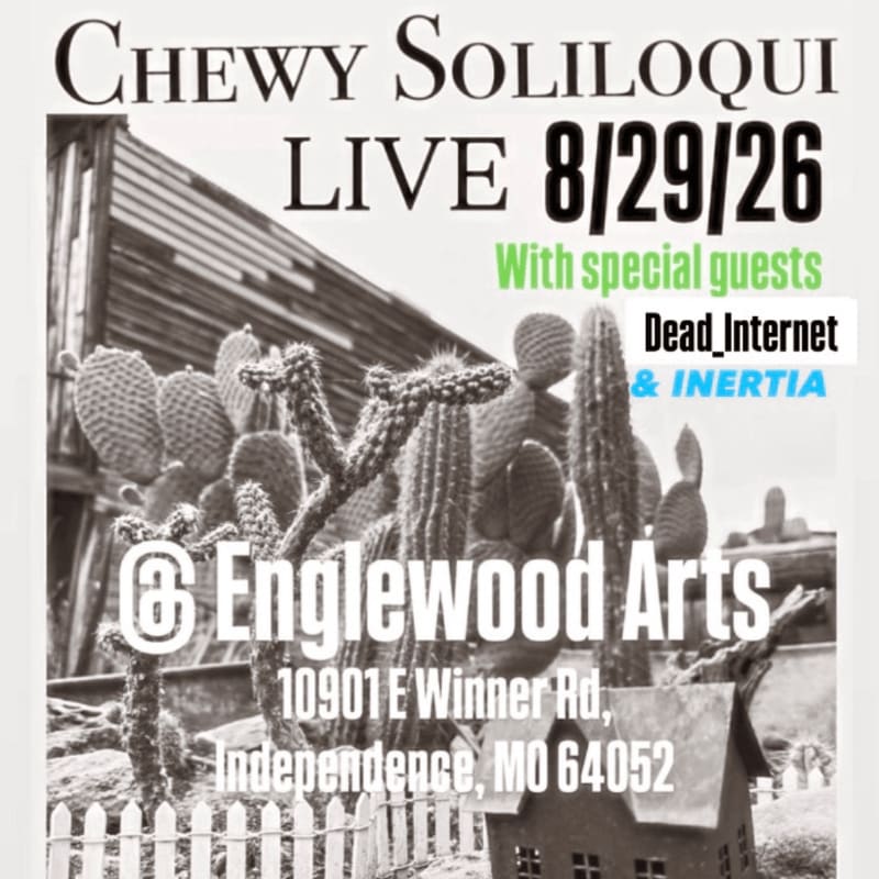 A black and white poster advertises a live performance by Chewy Soliloqui at Englewood Arts, featuring a foreground of various cacti and a small house, set against a rustic wooden structure in the background.