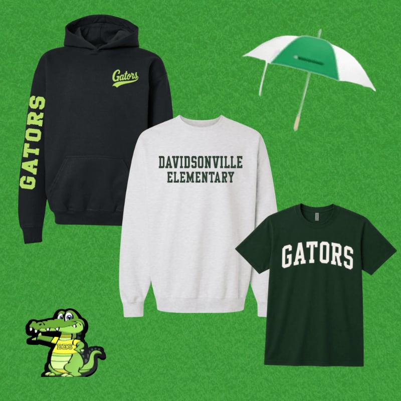 A black hoodie with "Gators" on the sleeve, a white sweatshirt with "DAVIDSONVILLE ELEMENTARY" across the chest, a green t-shirt with "GATORS" on the front, and a cartoon alligator are arranged on a green, grassy background with a white and green umbrella in the upper right corner.