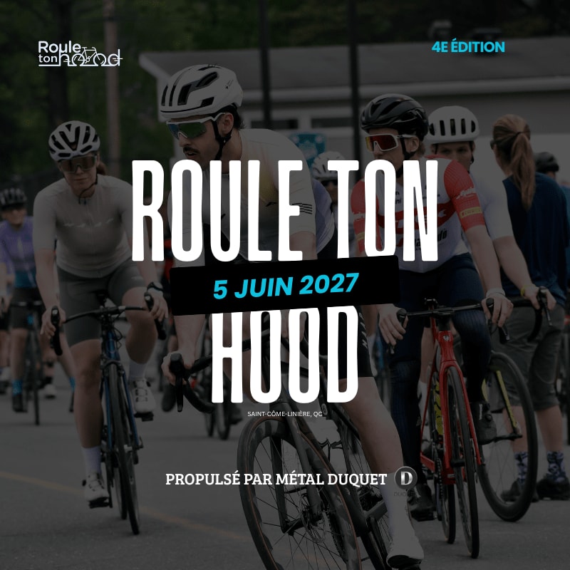 Cyclists in the foreground ride down a street with trees and buildings in the background, under a banner advertising "ROULE TON HOOD" on June 5, 2027.