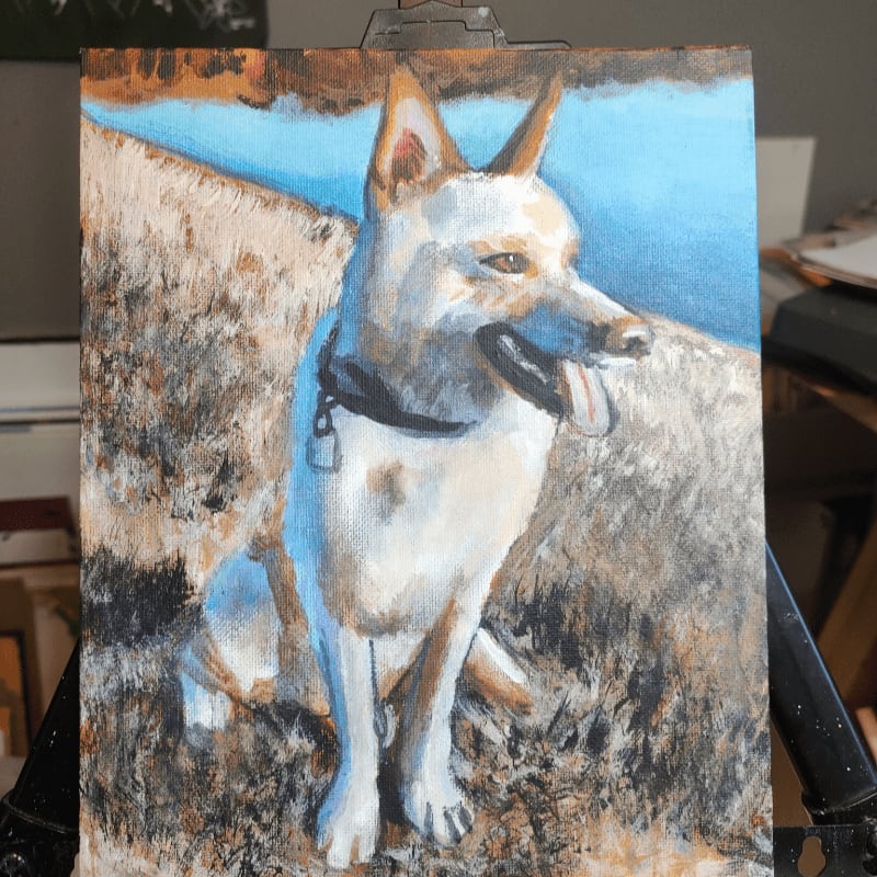 A painting of a white dog with a black collar sits in dry grass with a bright blue sky in the background.