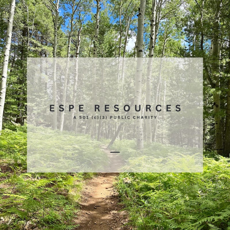 A dirt path winds through lush green ferns in the foreground, leading into a sun-dappled forest of aspen trees in the background, with "ESPE RESOURCES A 501(c)(3) PUBLIC CHARITY" overlaid in the center.