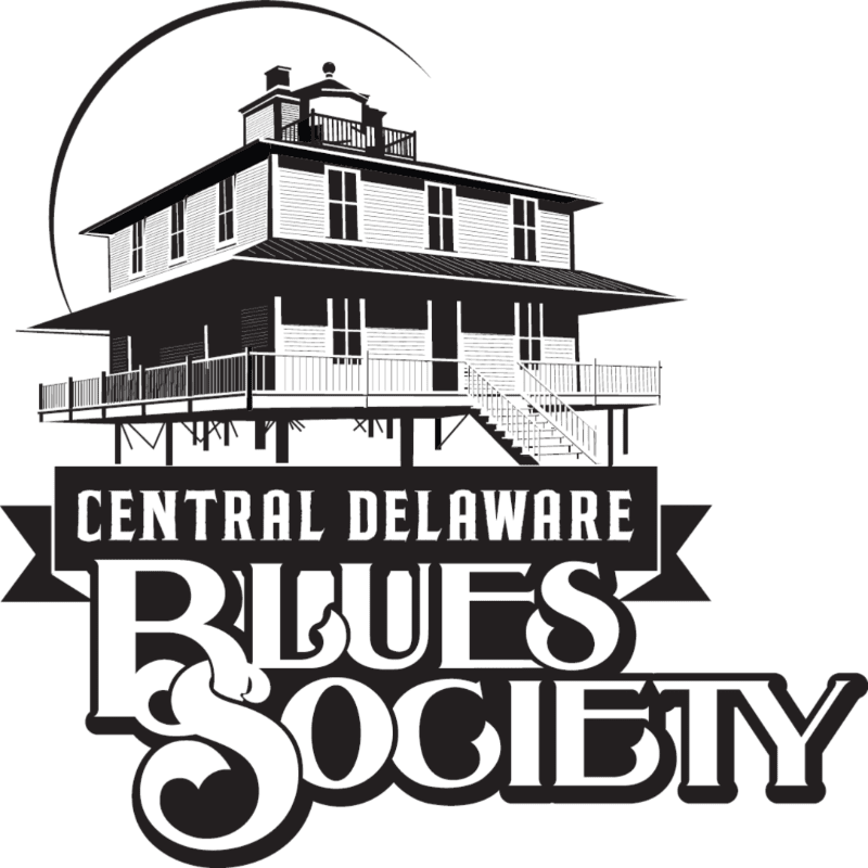 A stylized black and white illustration features a multi-story building with a wrap-around porch in the foreground, set against a large circular arc in the background, with the text "CENTRAL DELAWARE BLUES SOCIETY" prominently displayed below the building.