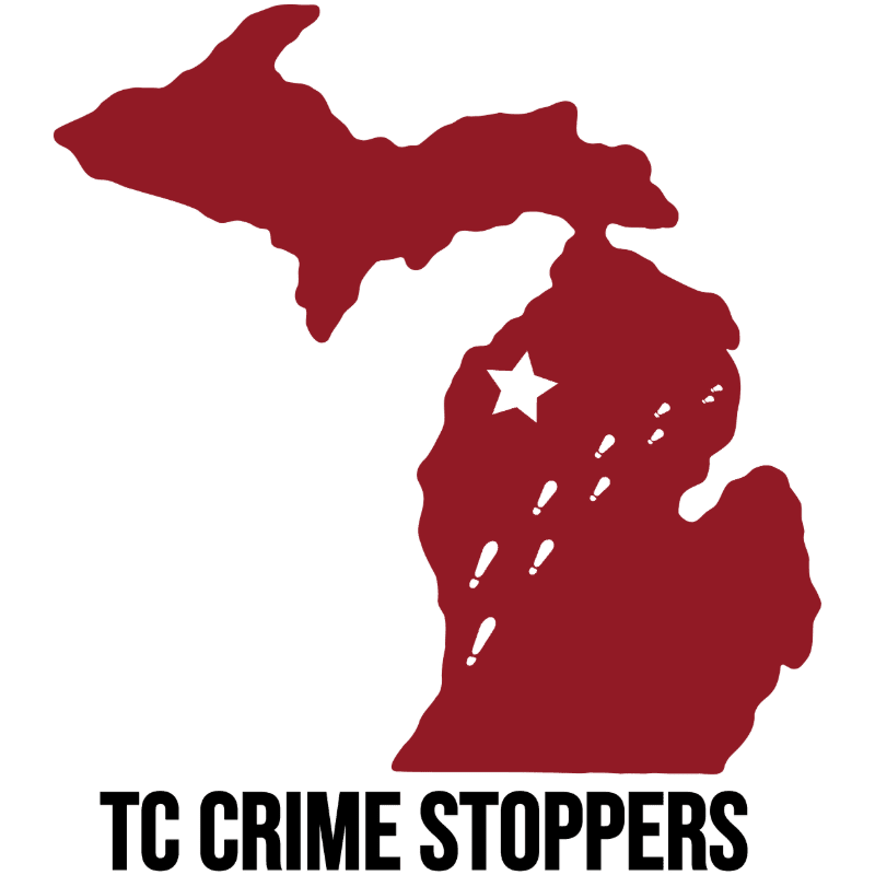 A red silhouette of Michigan with a white star and exclamation marks is superimposed on a white background, with "TC CRIME STOPPERS" written in black text below.