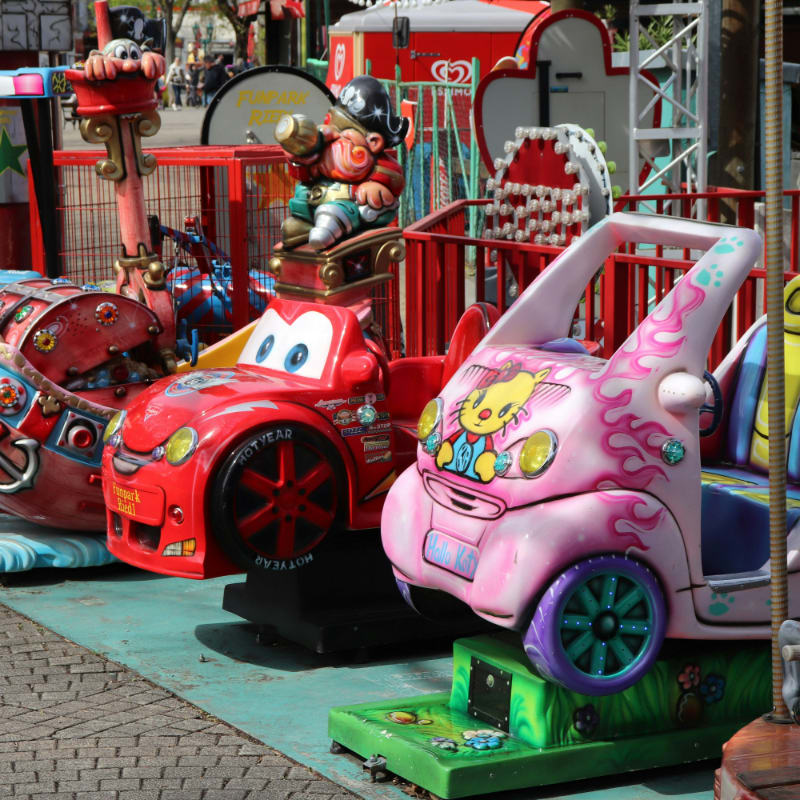 a row of toy cars sitting next to each other