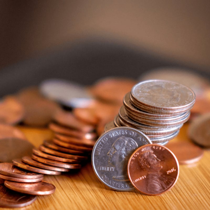 silver and gold coins on brown wooden table