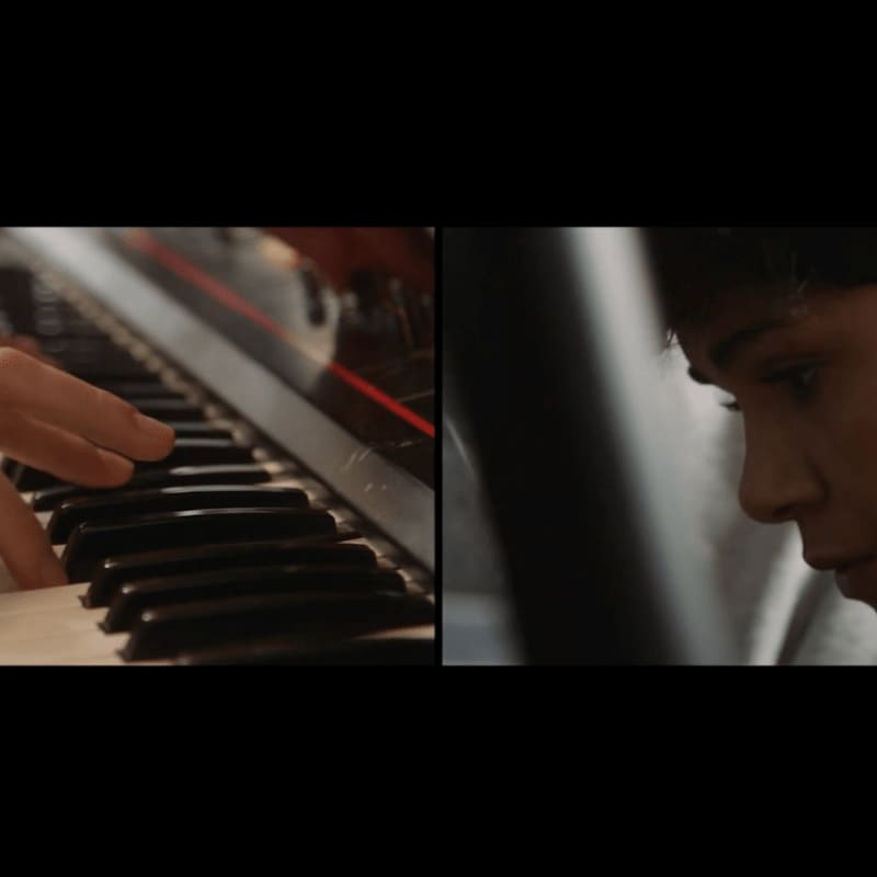 A close-up of a hand playing a piano is on the left, while a young person's profile is on the right.