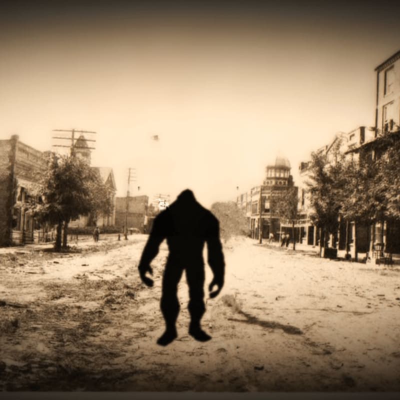 A shadowy, hulking figure stands in the foreground of a sepia-toned, old-fashioned street lined with buildings and trees in the background.