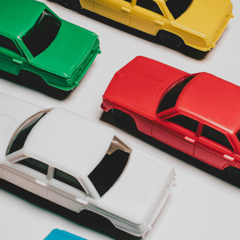 a group of toy cars sitting on top of a table