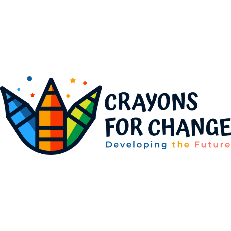 Three colorful crayons stand in the foreground, with the text "CRAYONS FOR CHANGE" and "Developing the Future" in the background.