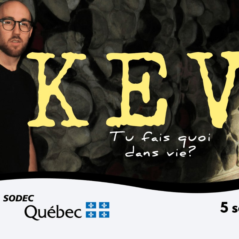 A man with glasses stands in the foreground to the left, with large yellow letters spelling "KEV" and French text in the background, over a dark, textured surface.