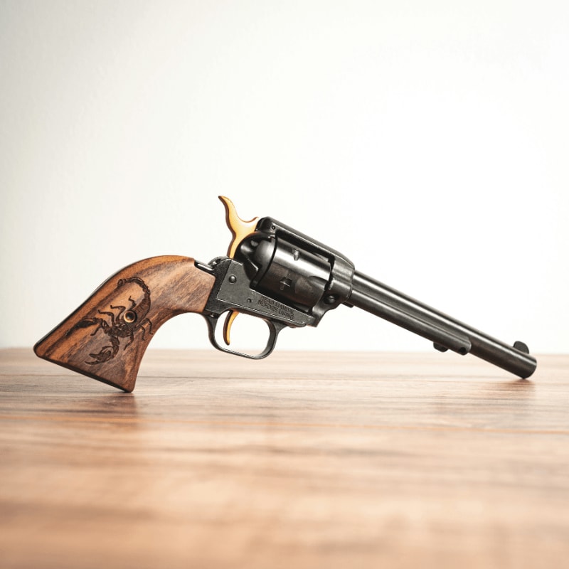 brown and black revolver pistol