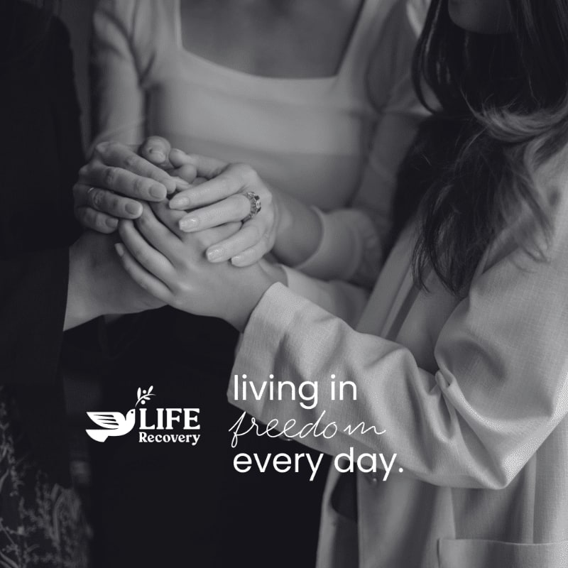 Three people hold hands in the foreground, with a logo and text overlaying the background.