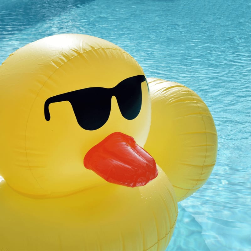 yellow inflatable balloon floating on water