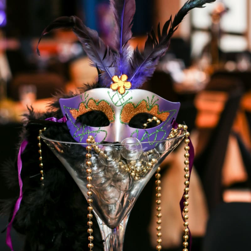 purple and white masquerade mask