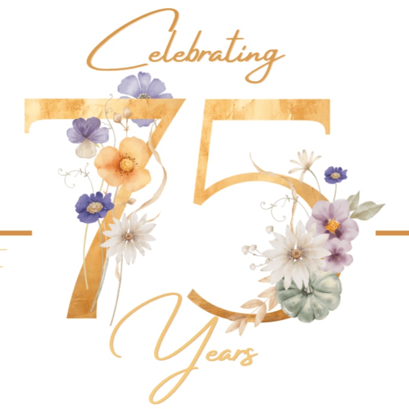 Golden numbers "75" are adorned with a floral arrangement of purple, orange, and white flowers and greenery in the foreground, with the words "Celebrating Years" in elegant script above and below the numbers against a white background.
