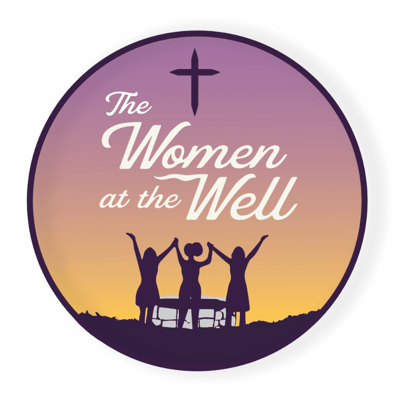 Three silhouetted women hold hands with raised arms in front of a well, beneath a cross and a gradient sky of purple and orange.