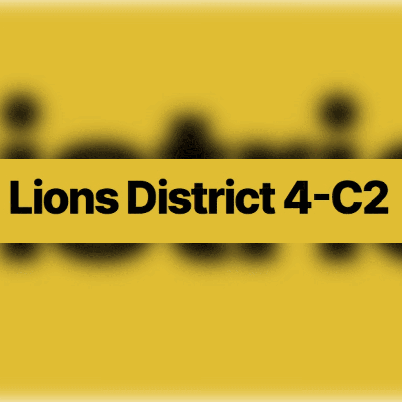 A yellow banner with black text reading "Lions District 4-C2" is centered against a blurred yellow background.
