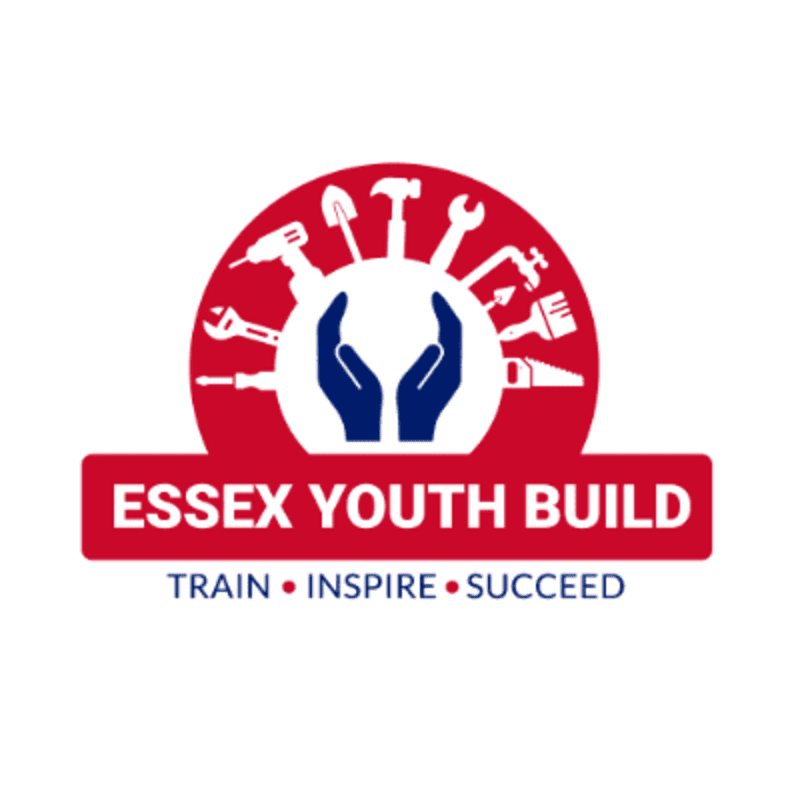 Two cupped hands are centered within a red semi-circle of various tools, above a red banner with white text reading "ESSEX YOUTH BUILD" and a white line of text below it reading "TRAIN INSPIRE SUCCEED".