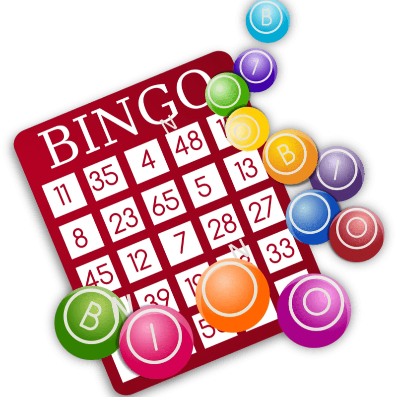 A red bingo card with numbers is partially covered by colorful bingo balls scattered around it.
