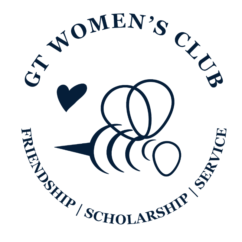 A stylized navy blue bee and heart are centered on a white background, surrounded by a circular navy blue text that reads "GT WOMEN'S CLUB" at the top and "FRIENDSHIP | SCHOLARSHIP | SERVICE" at the bottom.