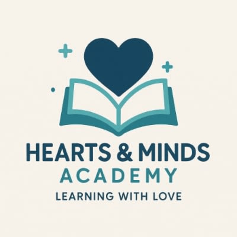 A dark blue heart rests atop an open book with "HEARTS & MINDS ACADEMY LEARNING WITH LOVE" written below, all set against a light beige background with small teal plus signs.