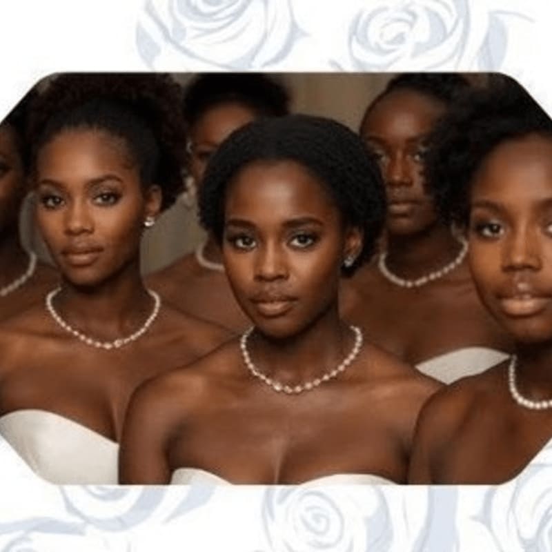 Several young Black women with pearl necklaces stand in the foreground, while a soft, floral pattern frames the background.