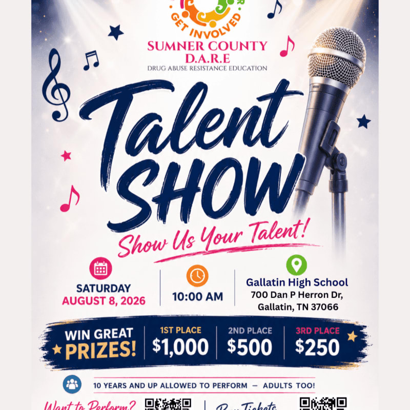 A microphone stands in the foreground against a background advertising a D.A.R.E. talent show with prize money and event details.