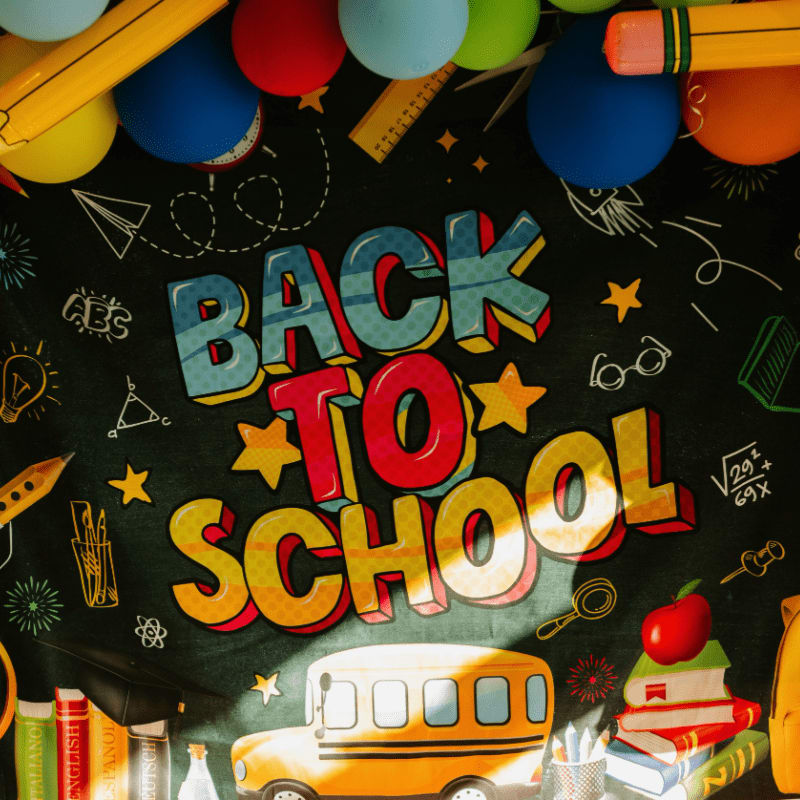 Back to school sign with balloons and decorations.