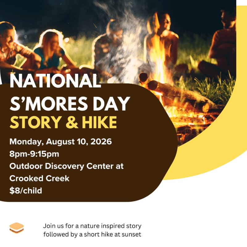 A group of people gather around a campfire in the foreground, with text announcing a "National S'mores Day Story & Hike" event in the background.
