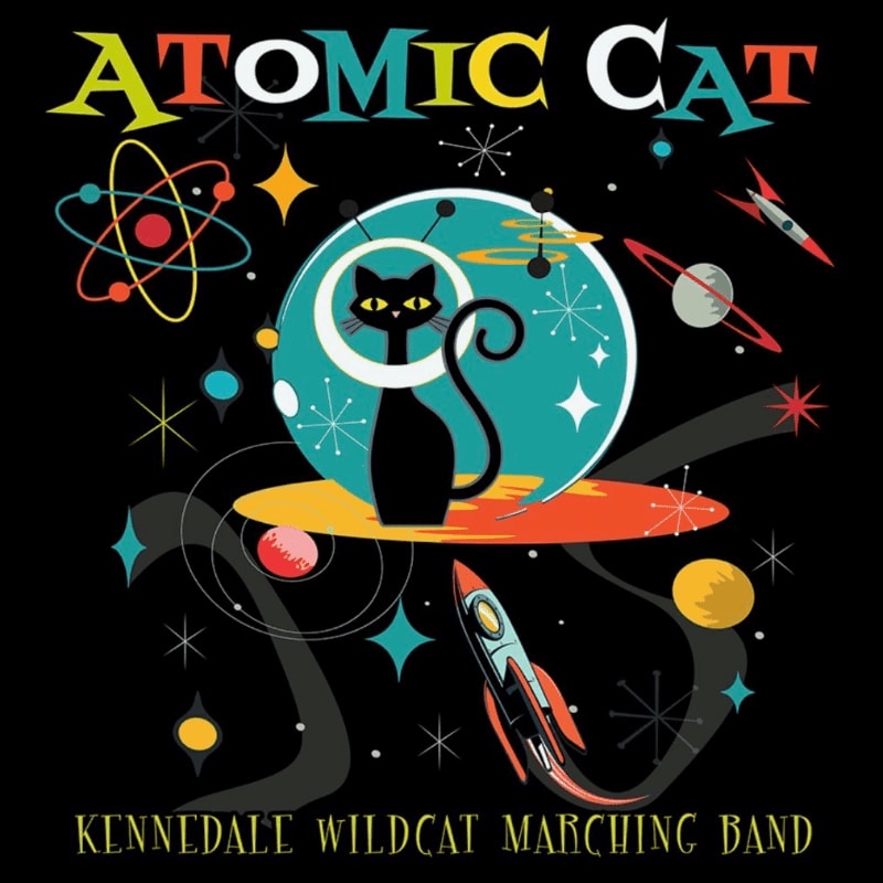 A black cat sits on a colorful planet with rockets and atomic symbols in the background, all under the "Atomic Cat" title and "Kennedale Wildcat Marching Band" text.