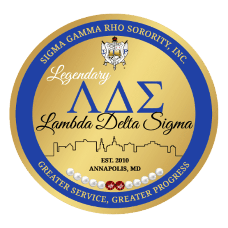 A circular emblem with a gold background features the Greek letters Lambda Delta Sigma and the sorority name in blue and white lettering, with a silhouette of a city skyline and the founding date and location below, all within a blue border.