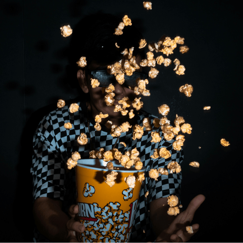 woman in blue and white polka dot shirt holding yellow ceramic mug