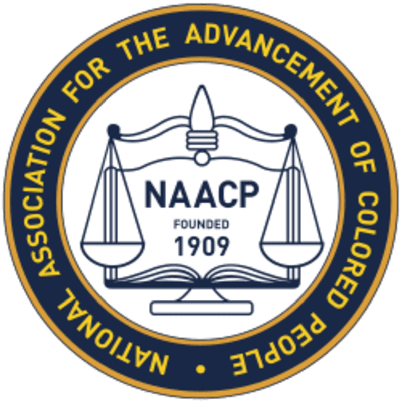 A circular emblem with the NAACP logo, featuring scales of justice and the text "National Association for the Advancement of Colored People," is set against a plain white background.