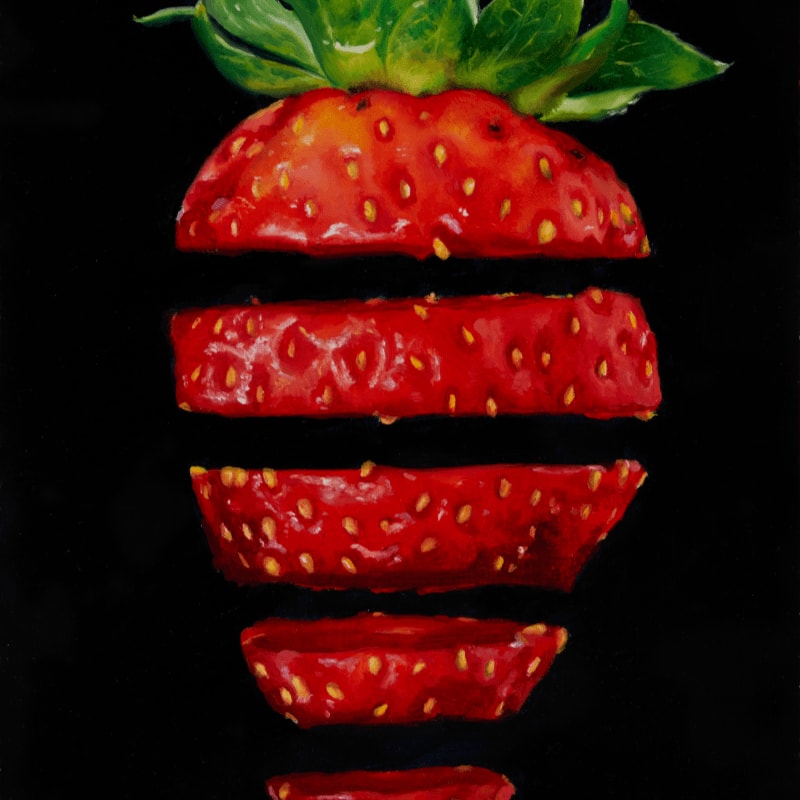 A sliced strawberry with vibrant red segments floats against a stark black background.