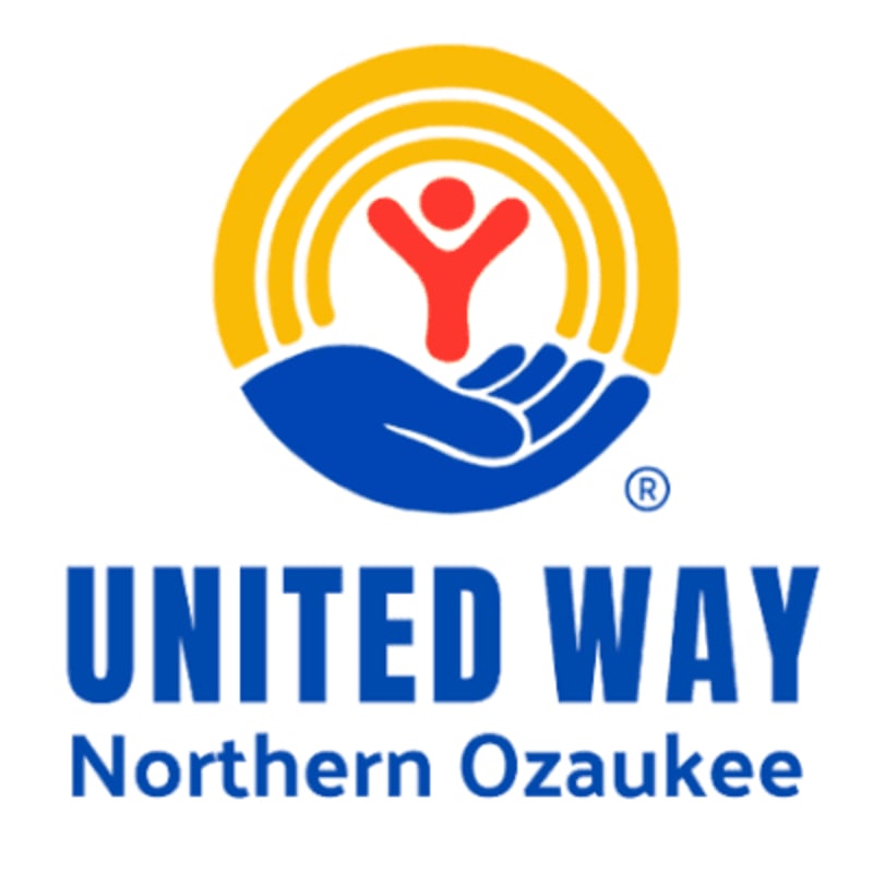 A blue hand cradles a red figure beneath a yellow arc, with "UNITED WAY Northern Ozaukee" text below on a white background.