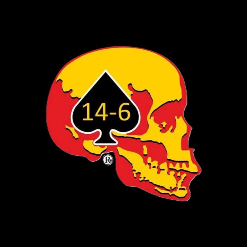 A red and yellow skull with a black spade containing "14-6" in white is set against a solid black background.