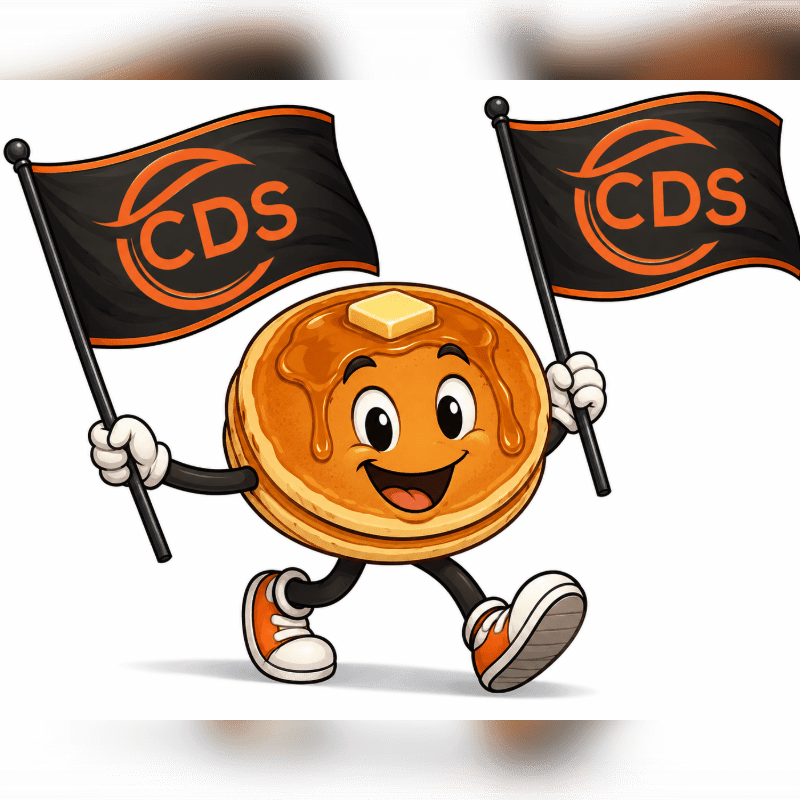 A smiling pancake character with arms and legs, wearing sneakers, holds two black flags with an orange logo in the foreground, against a white background with a subtle grey border.