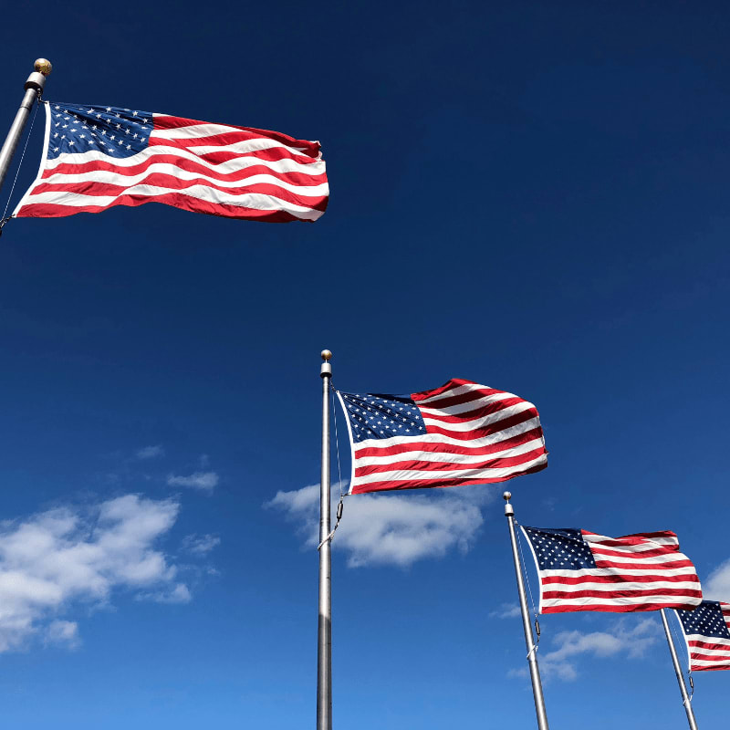U.S. American flags under clear sky