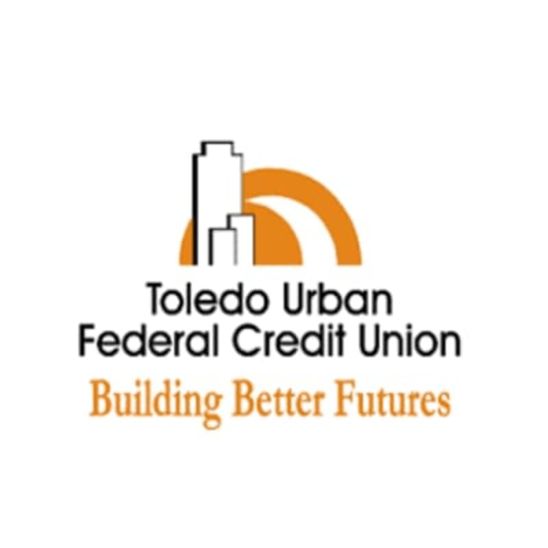 Two white buildings and an orange arch are in the foreground, with the words "Toledo Urban Federal Credit Union Building Better Futures" below them, all against a white background.